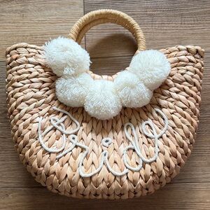 “Bride” Woven Straw Pom-Pom Tote Bag in Natural